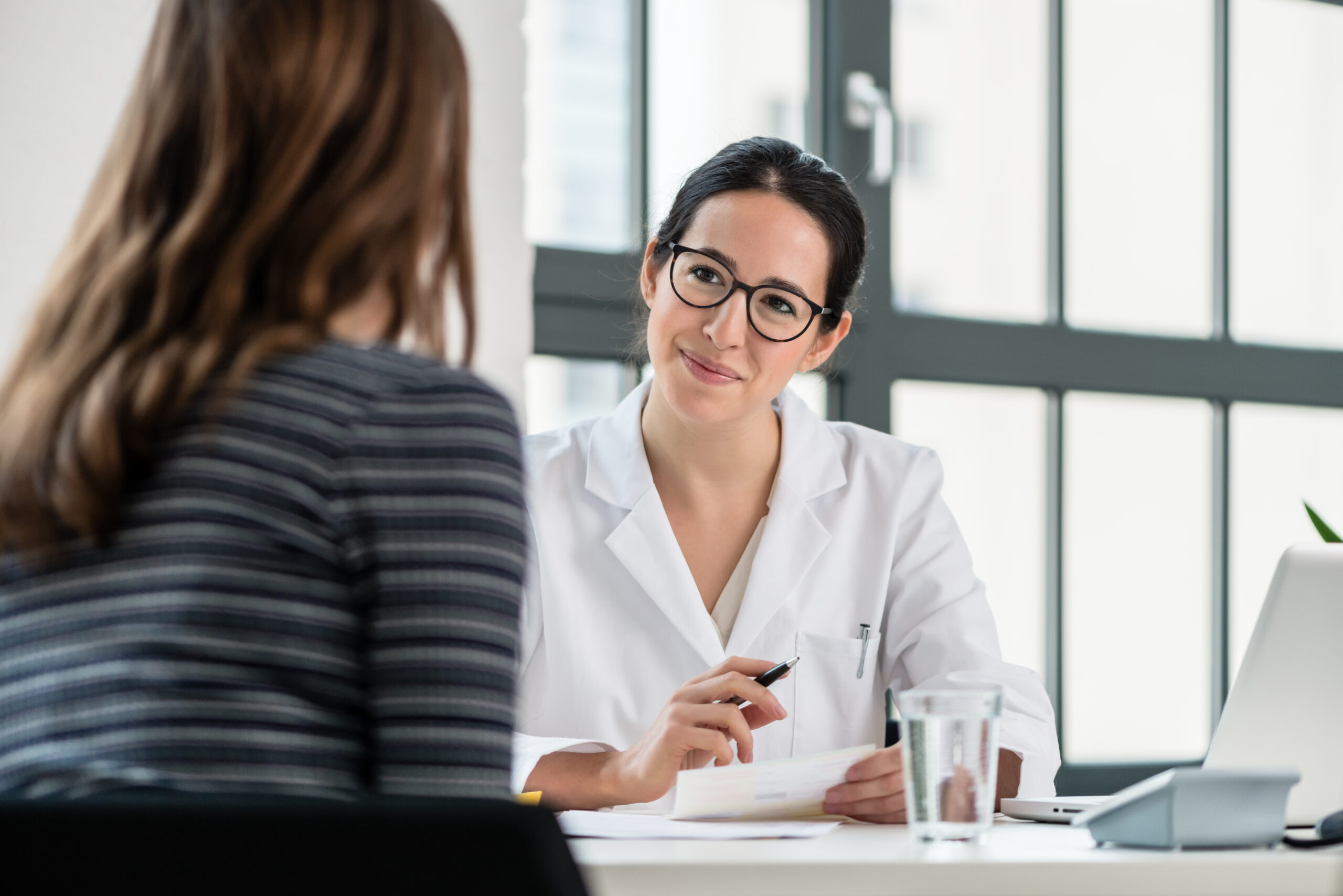 Female doctor advising woman she can try for pregnancy after miscarriage | Loma Linda Univ. Fertility | California